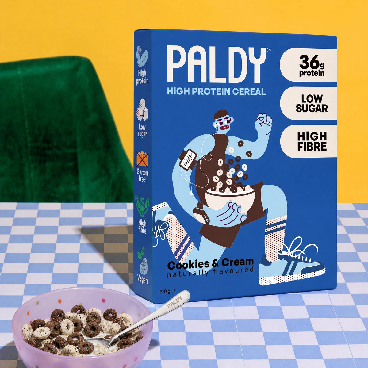 Paldy Cookies & Cream high protein cereal box next to a bowl of cereal with milk